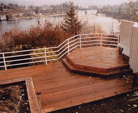 Custom deck and metal railing designed by Seattle landscaper, Environmental Construction
