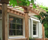 Pergola over windows provides partial shade
