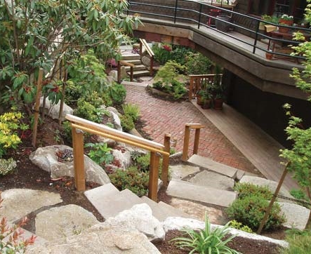 Hillside landscaping with plantings and rock