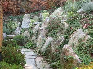 Seattle, WA landscaper creates walkways and more usable space for Bellevue home.