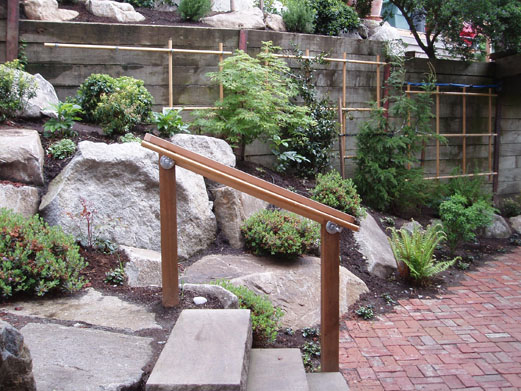 Steps to upper terrace of backyard landscaping 