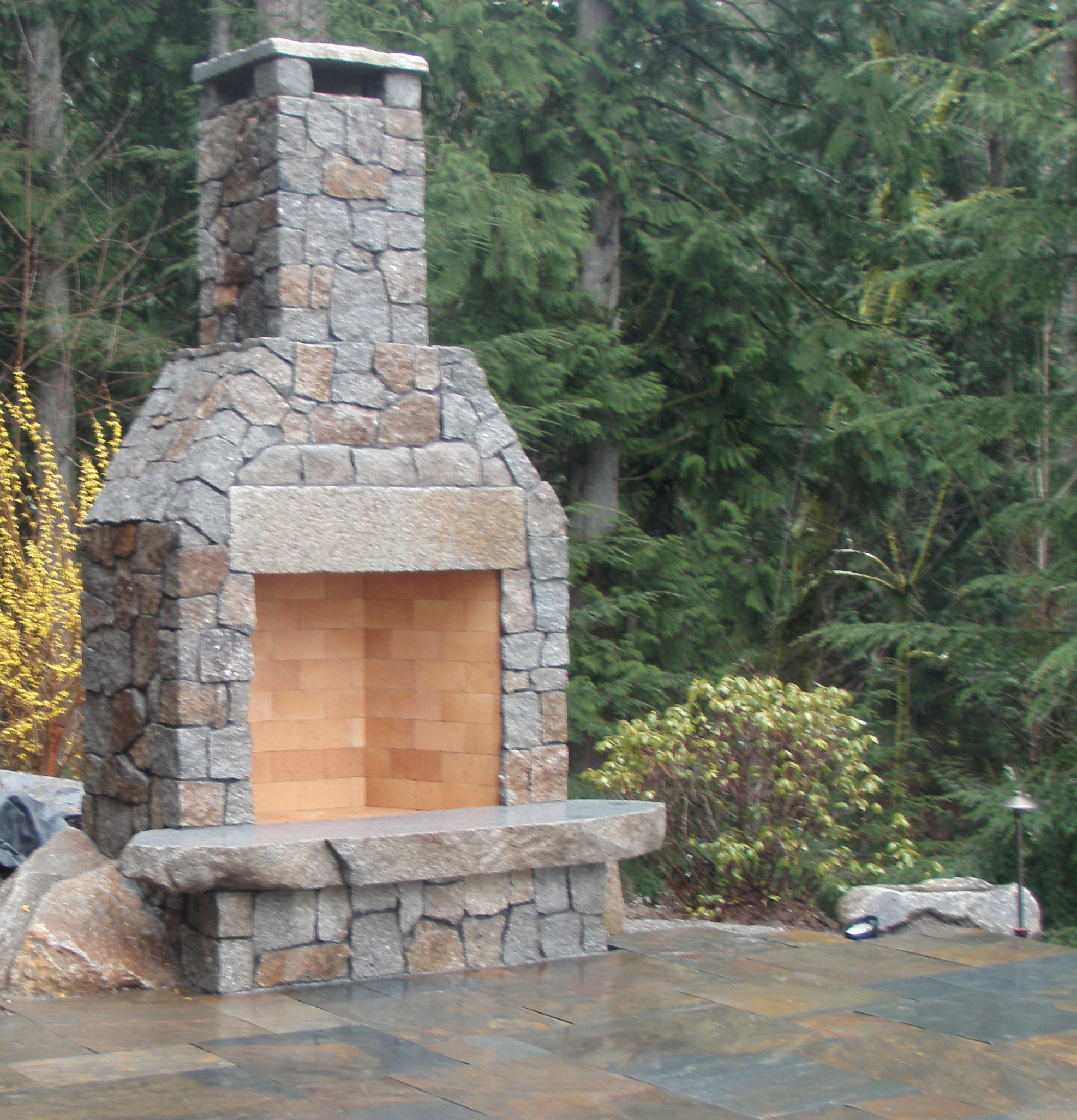 Stone fireplace designed by Environmental Construction Inc. in Kirkland WA